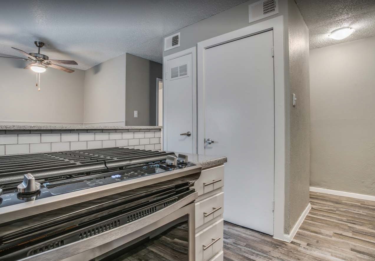 Kitchen with granite style counters and dishwasher